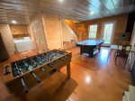 Gameroom in the basement offers a air hockey, foosball table & the laundry room 